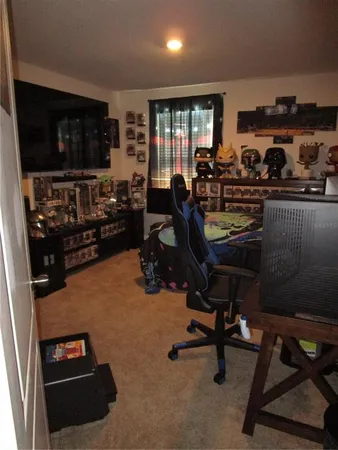 a view of a workspace with furniture and a livingroom