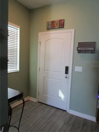 a view of washer and dryer with wooden floor