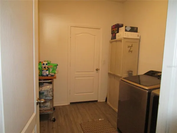 a view of a house with backyard and porch