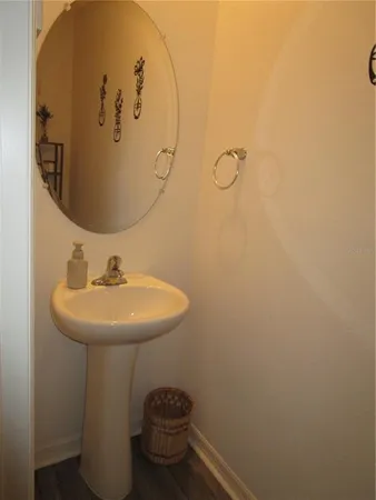a bathroom with a toilet and a mirror