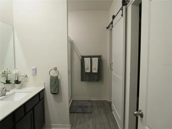 a bathroom with a sink and mirror