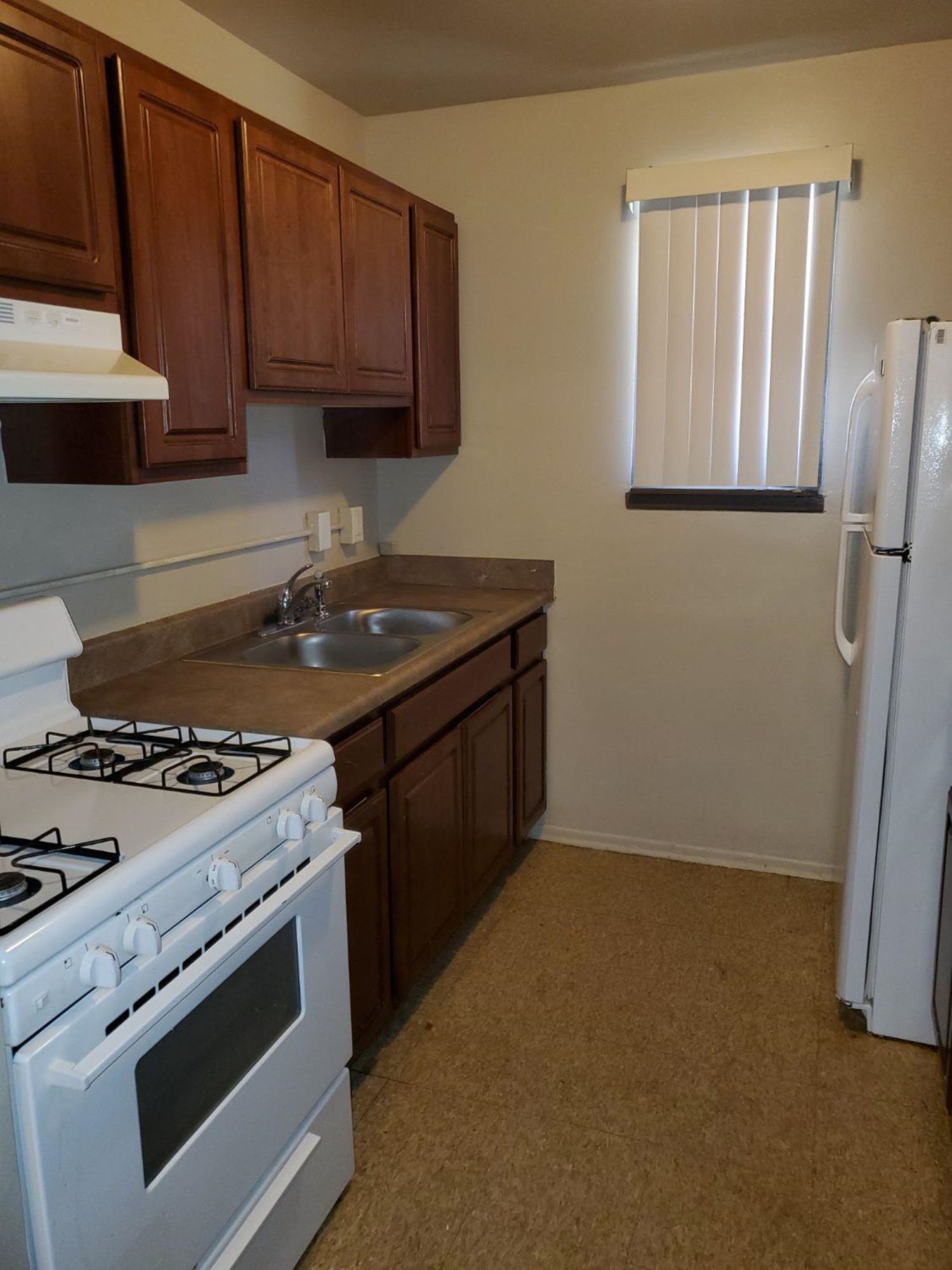 263 Hamlin Street Gary, IN 46406 - Photo 2 of 6 a kitchen with a stove and a cabinet