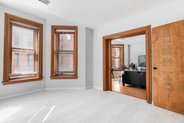 an empty room with mirror in it