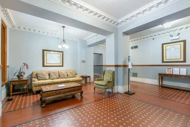 a view of a livingroom with furniture and window