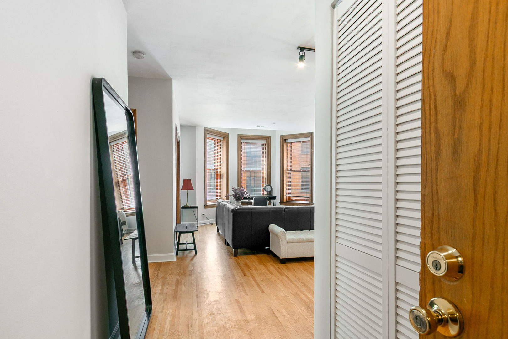 550 West Surf Street, Unit C316 Chicago, IL 60657 - Photo 4 of 16 a view of a livingroom with furniture and window