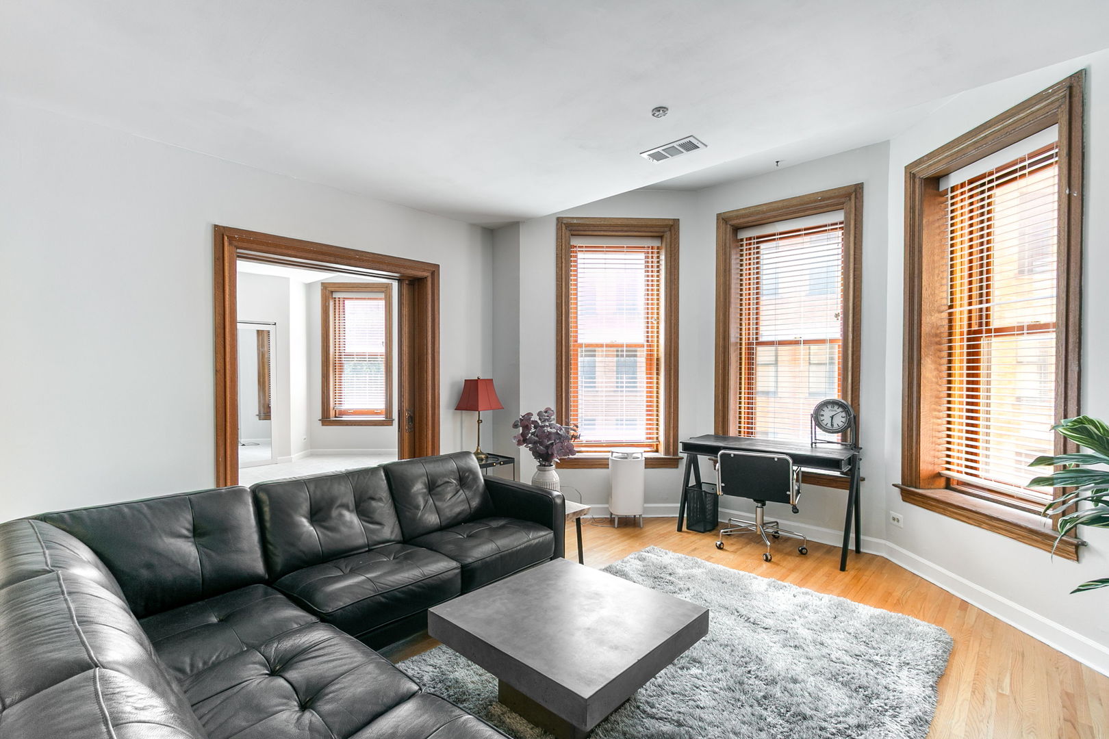 550 West Surf Street, Unit C316 Chicago, IL 60657 - Photo 6 of 16 a living room with furniture and a window