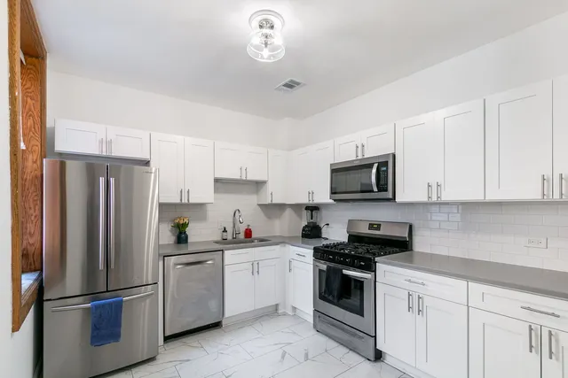 a kitchen with a stove and a microwave