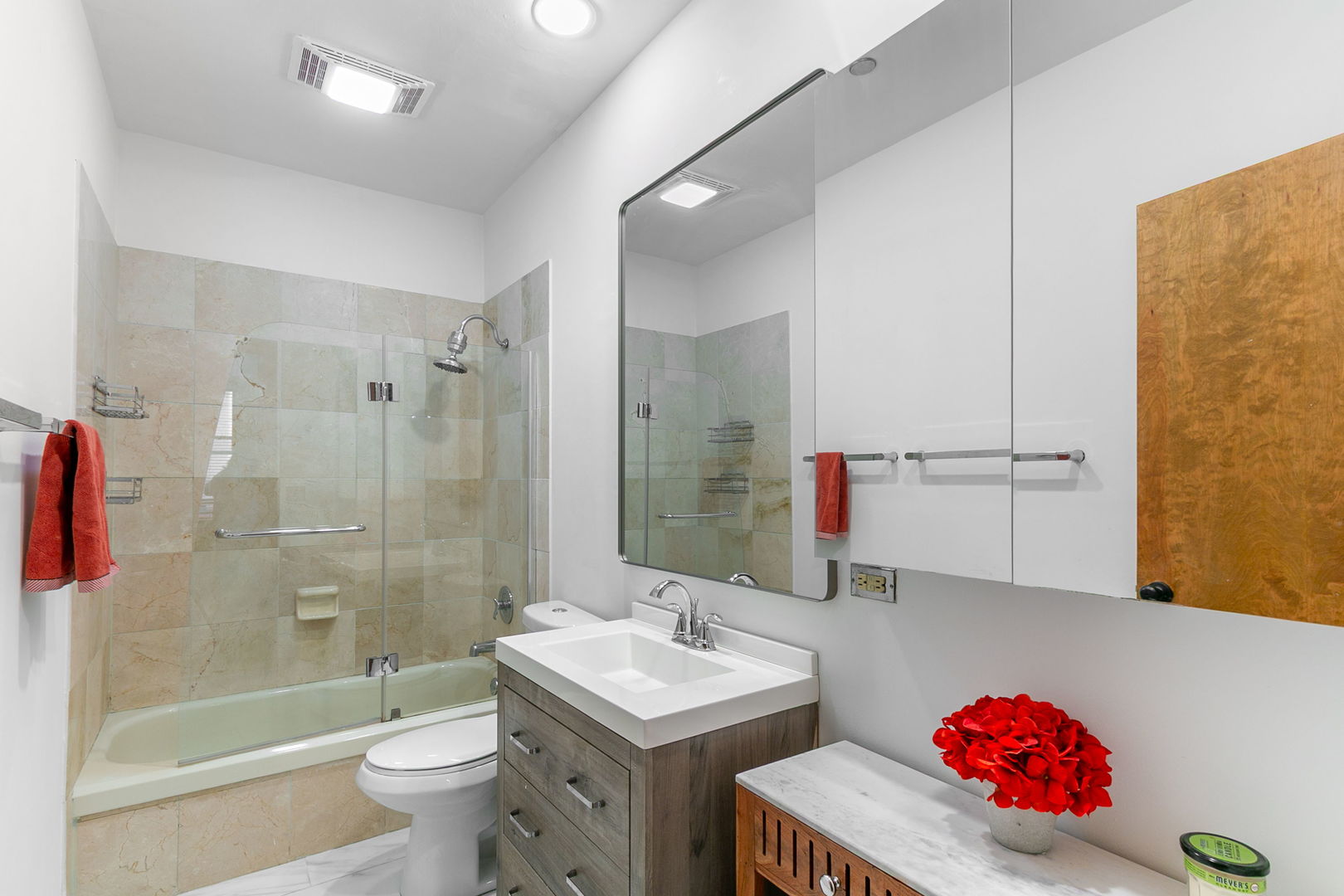 550 West Surf Street, Unit C316 Chicago, IL 60657 - Photo 10 of 16 a bathroom with a sink toilet and shower
