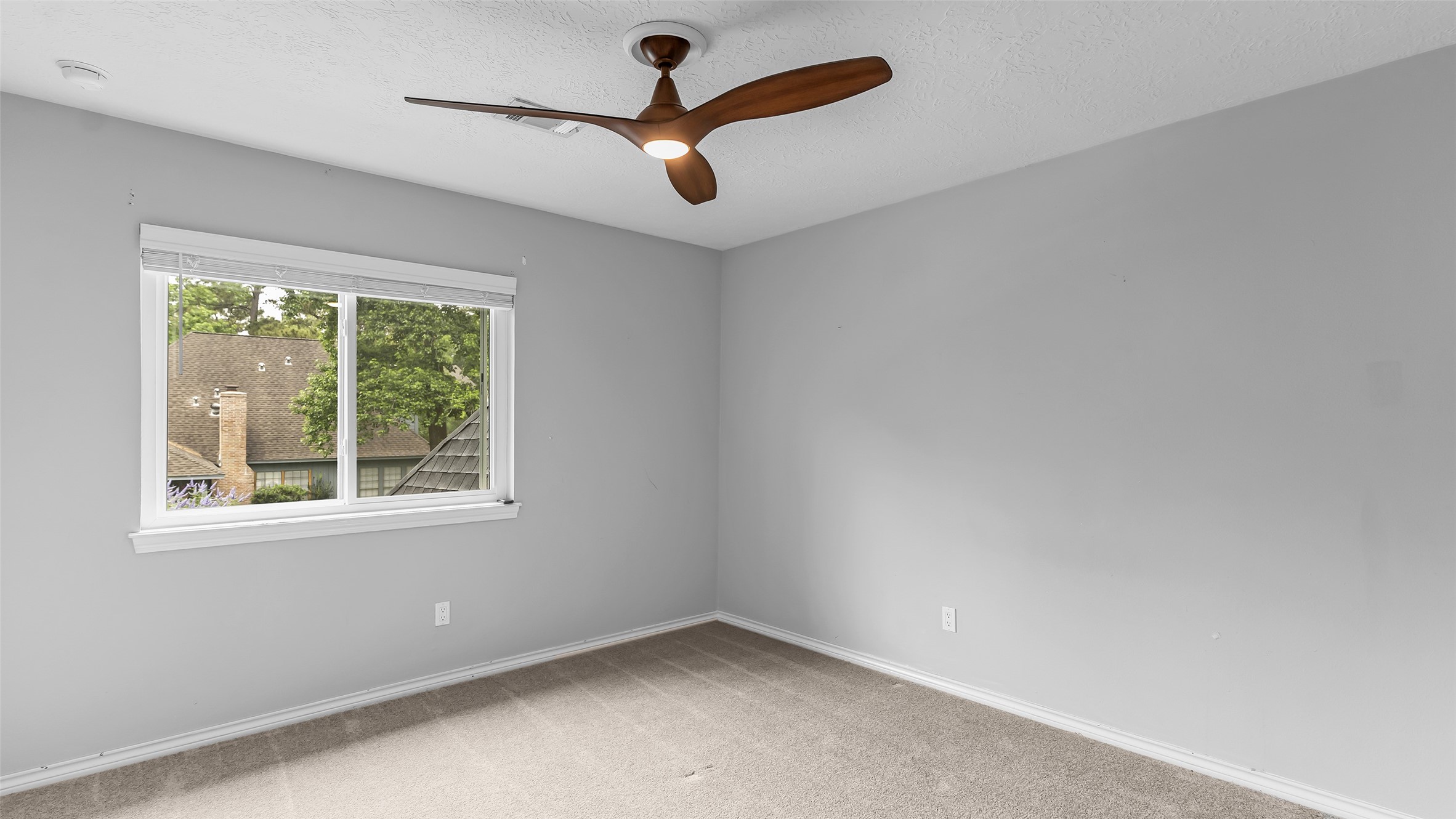 2607 Laurel Ridge Drive Houston, TX 77345 - Photo 38 of 47 an empty room with a window
