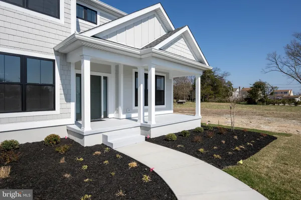 a kitchen with stainless steel appliances granite countertop a stove top oven a sink dishwasher a dining table and chairs