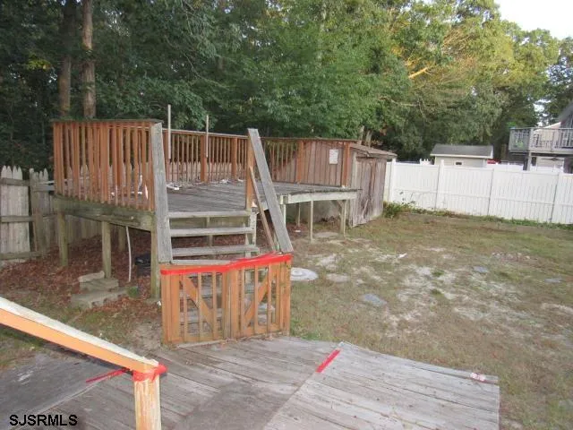 a view of a dinning area with wooden fence