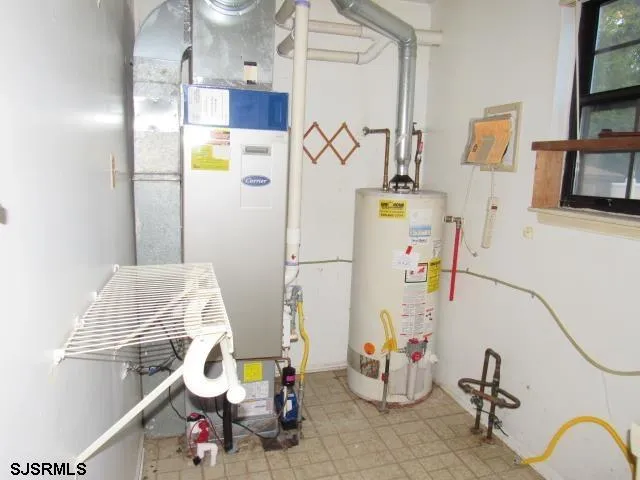 a bathroom with a sink mirror and shower