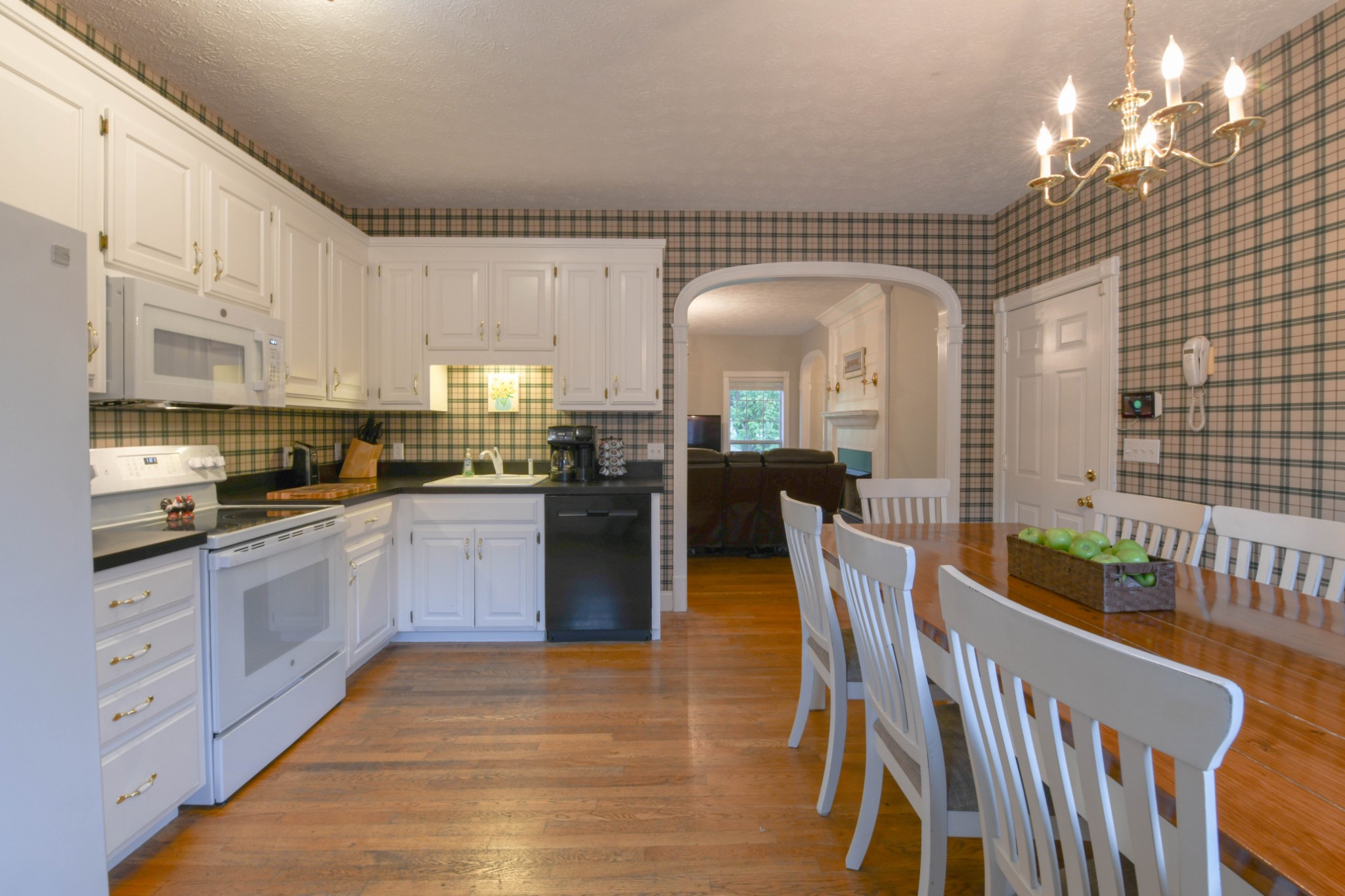 2558 South Mt Pleasant Road Greenbrier, TN 37073 - Photo 11 of 36 a kitchen with stainless steel appliances granite countertop a refrigerator a stove a sink dishwasher and white cabinets with wooden floor