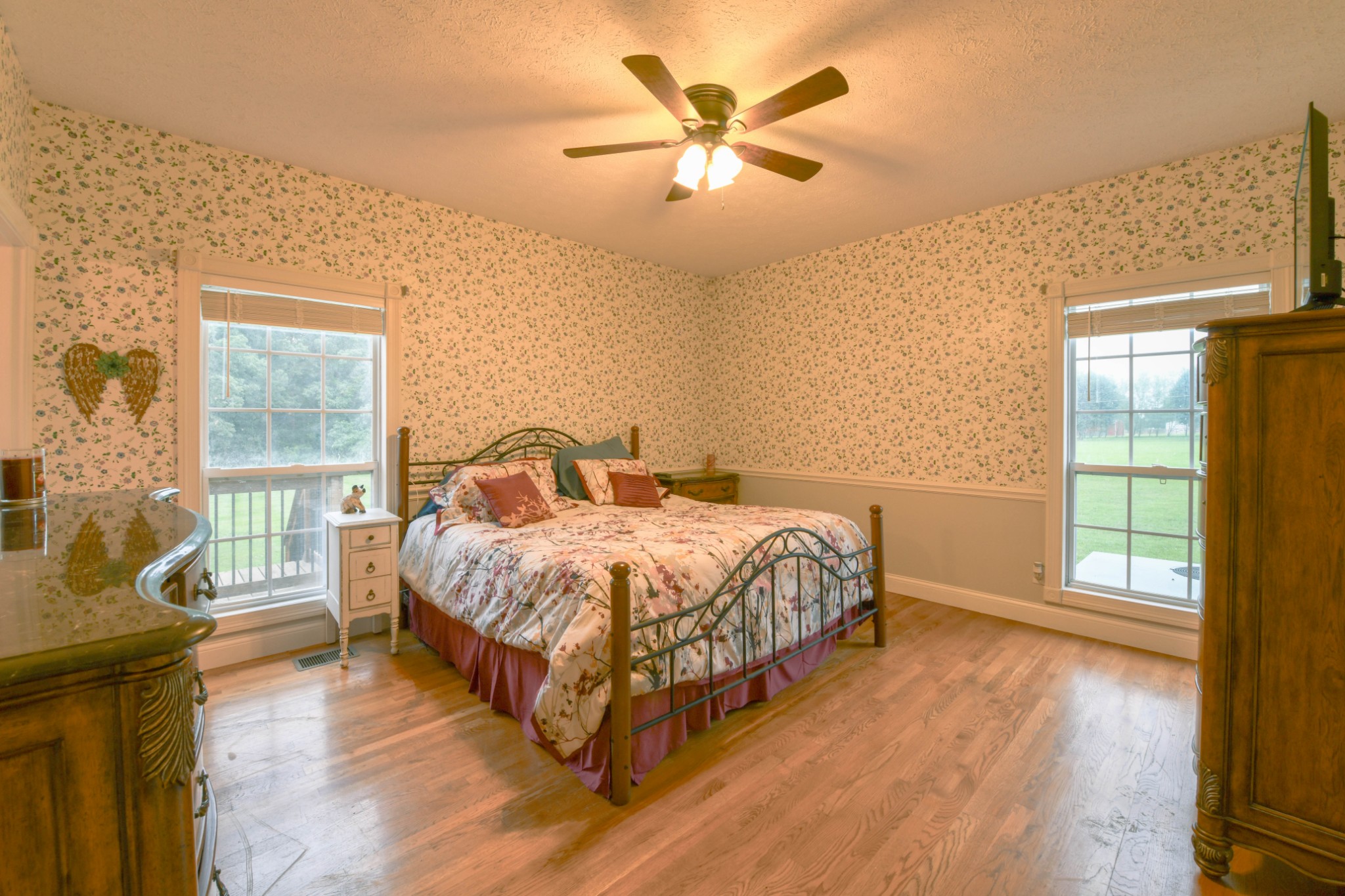 2558 South Mt Pleasant Road Greenbrier, TN 37073 - Photo 17 of 36 a spacious bedroom with a bed and wooden floor