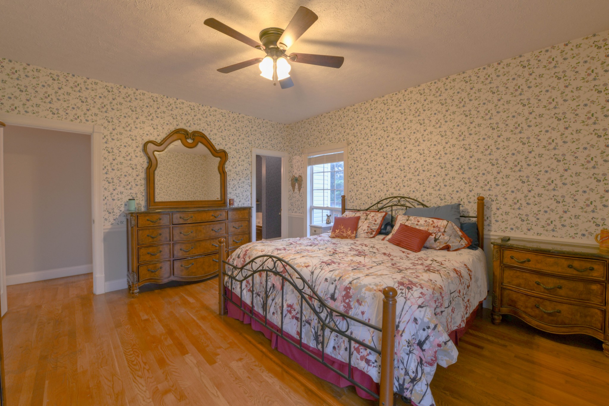 2558 South Mt Pleasant Road Greenbrier, TN 37073 - Photo 18 of 36 a bedroom with a bed and a dresser with wooden floor