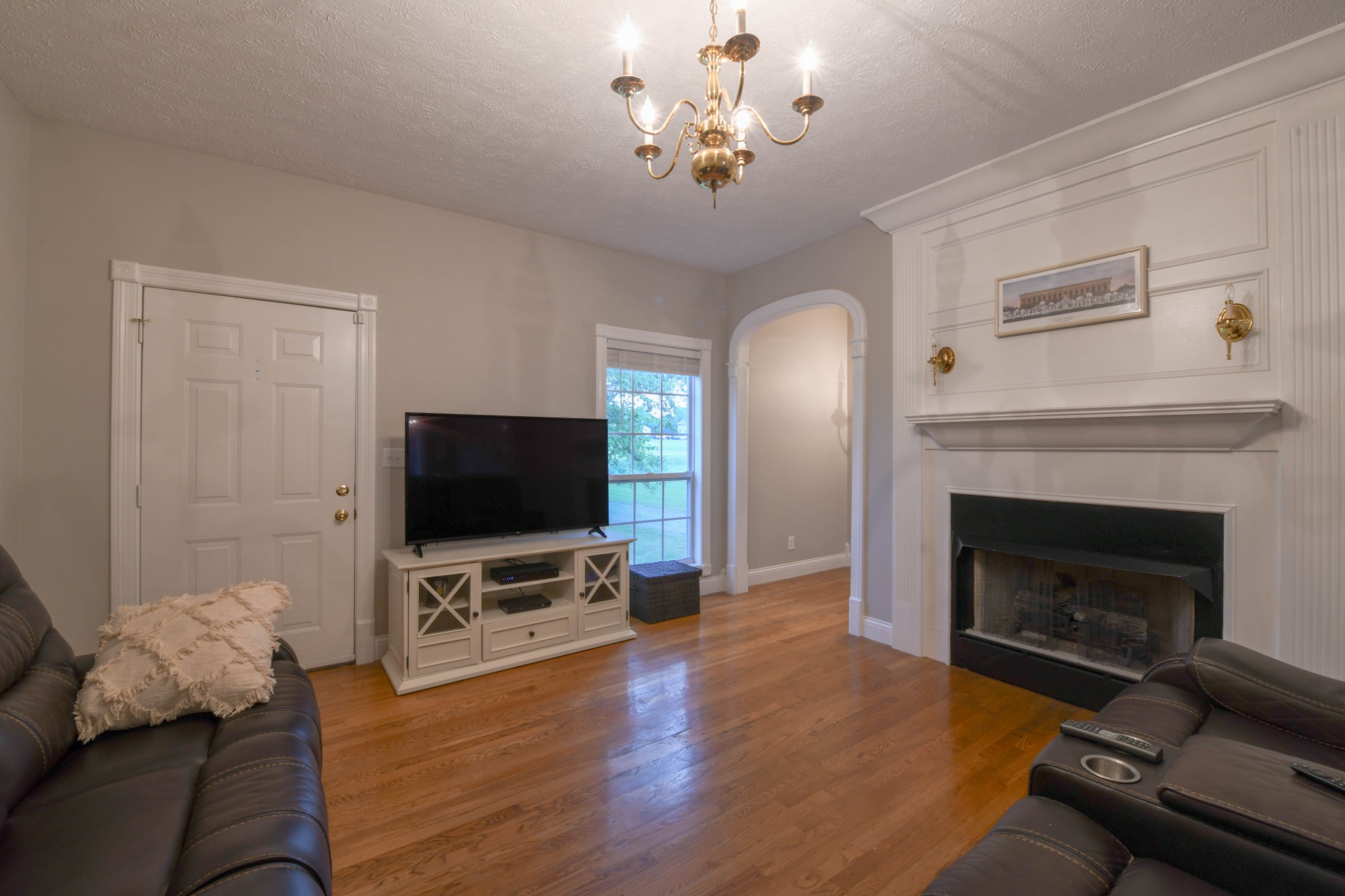 2558 South Mt Pleasant Road Greenbrier, TN 37073 - Photo 6 of 36 a living room with furniture a flat screen tv and a fireplace