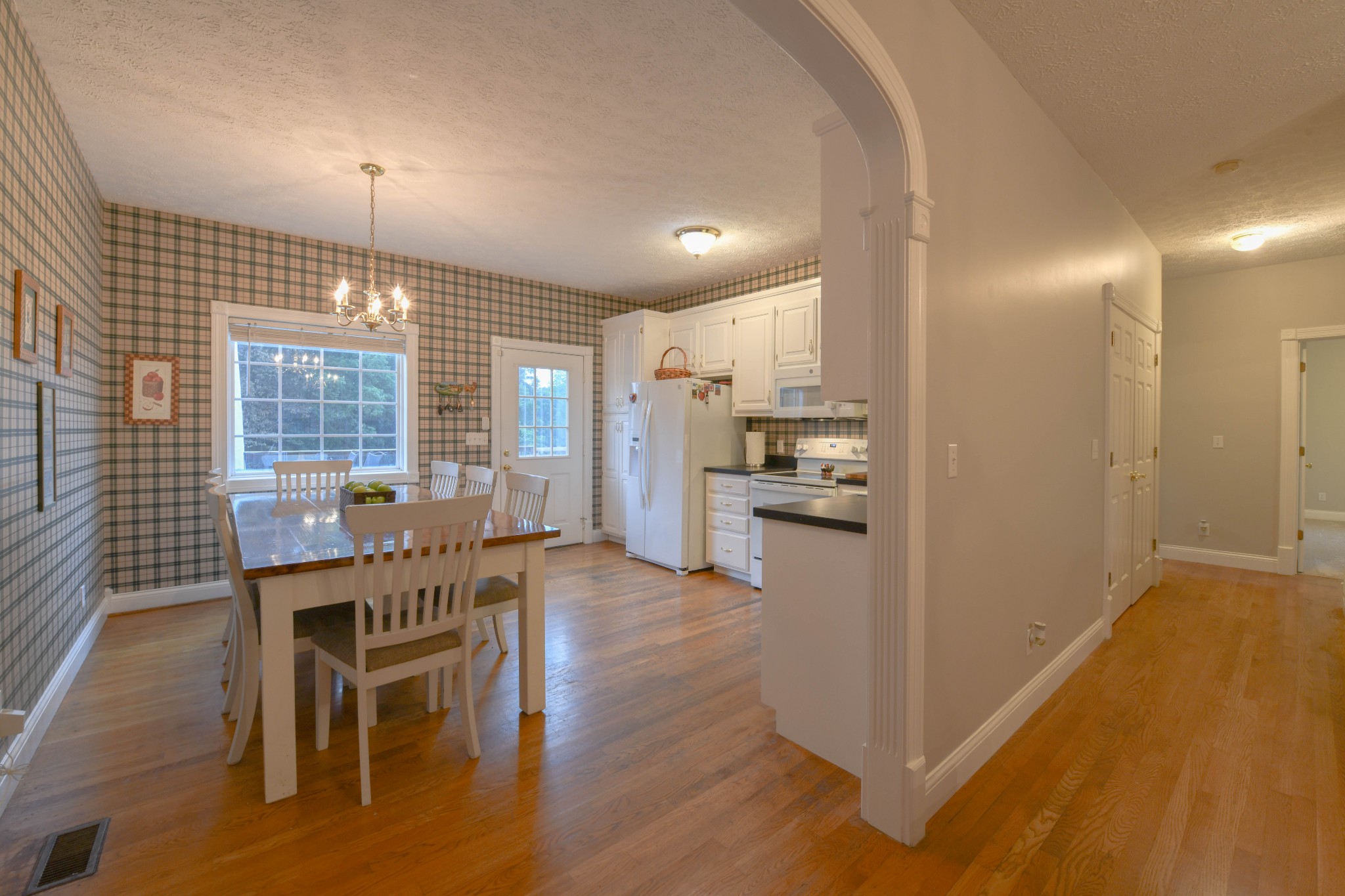 2558 South Mt Pleasant Road Greenbrier, TN 37073 - Photo 8 of 36 a kitchen with granite countertop white cabinets and stainless steel appliances