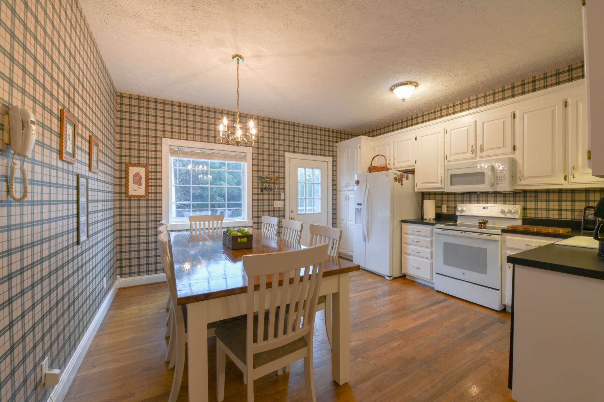 2558 South Mt Pleasant Road Greenbrier, TN 37073 - Photo 9 of 36 a kitchen with stainless steel appliances kitchen island granite countertop a stove a refrigerator a kitchen island with a dining table and chairs