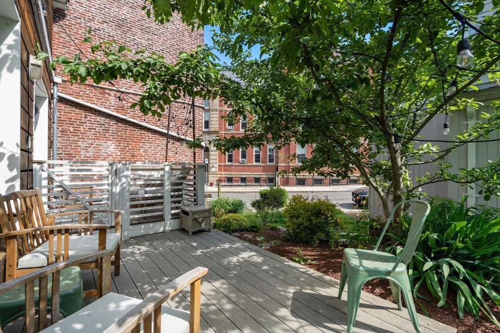 67 Dudley Street, Unit SF Boston, MA 02119 - Photo 24 of 28 a view of a chair and table in the backyard