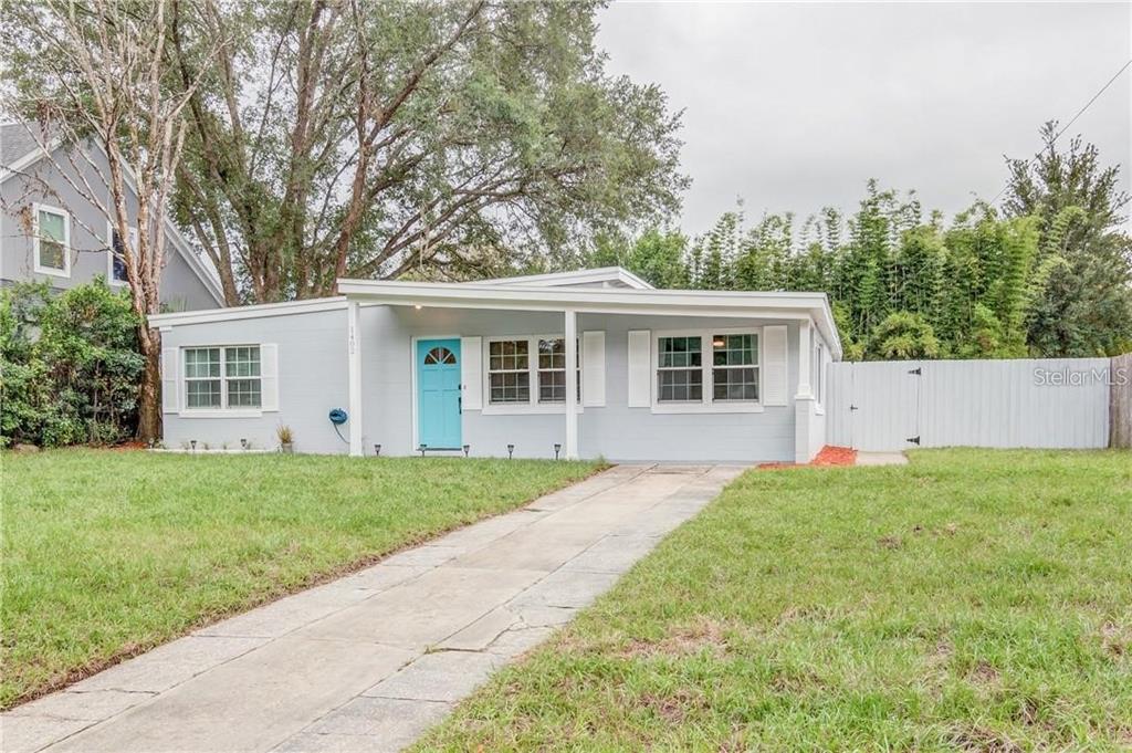1402 Bessmor Road Winter Park, FL 32789 - Photo 1 of 1 front view of a house and a yard