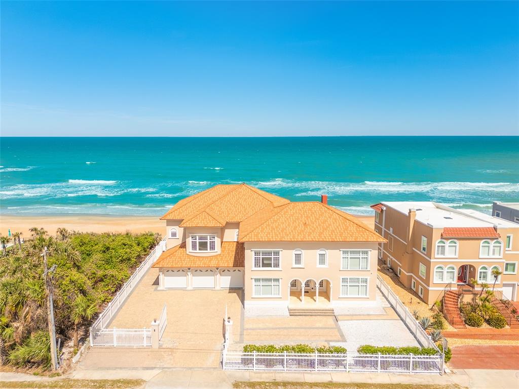 a view of a big building with an ocean