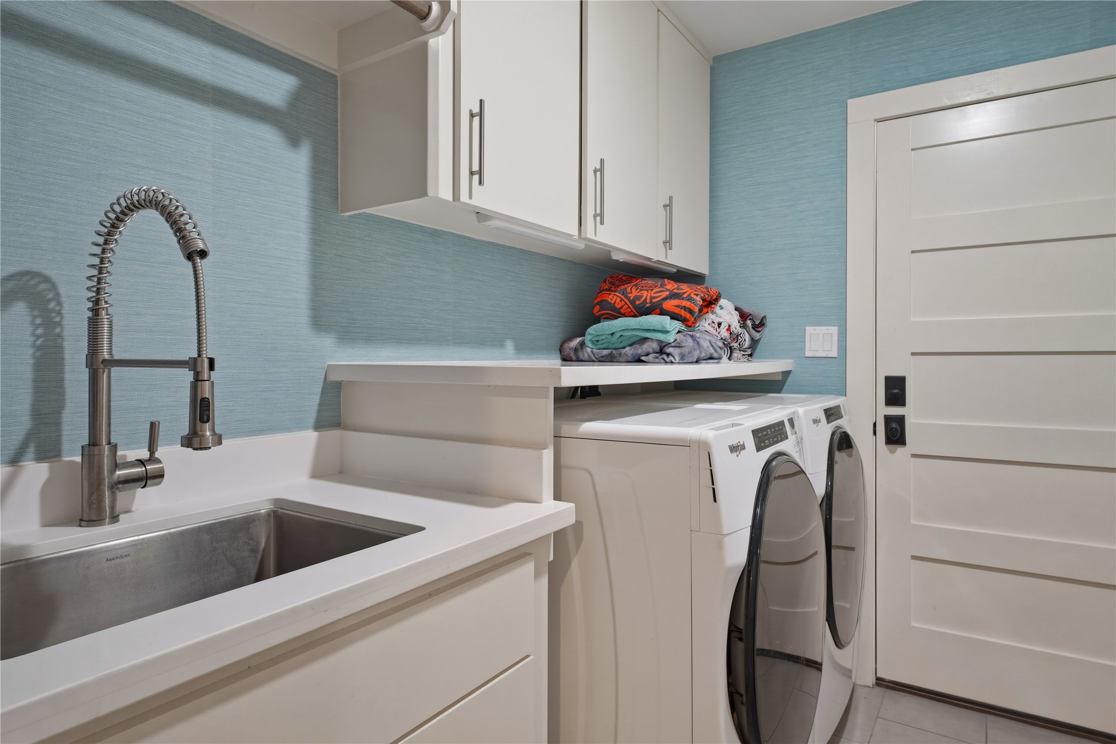 1124 Bowie Street Columbus, TX 78934 - Photo 7 of 28 a view of a sink and washer dryer