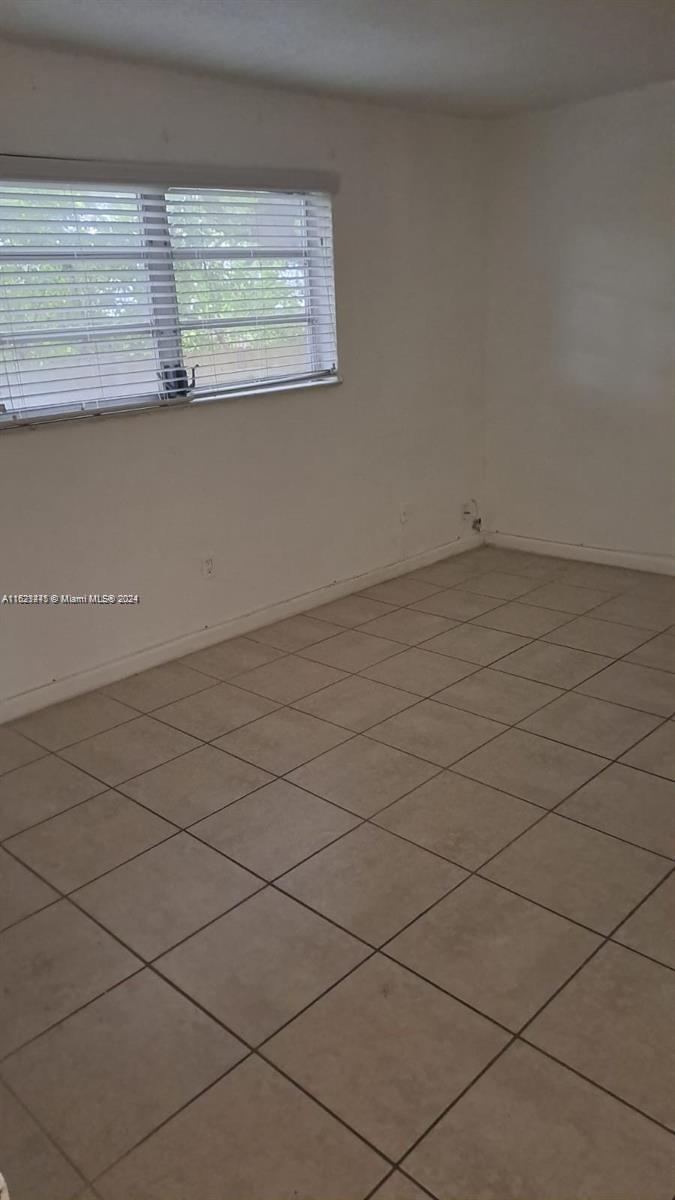 3265 Griffin Road, Unit 104 Dania Beach, FL 33312 - Photo 3 of 14 an empty room