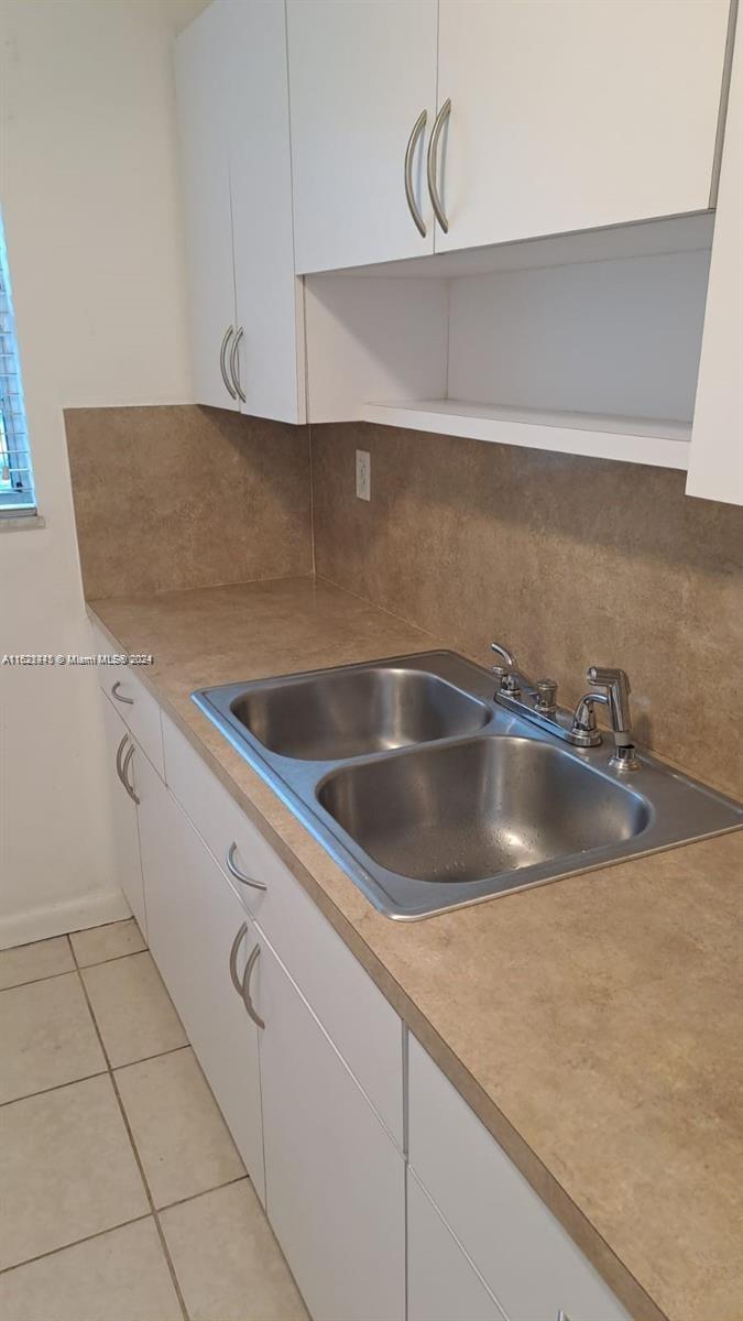 3265 Griffin Road, Unit 104 Dania Beach, FL 33312 - Photo 4 of 14 a close view of sink and tap