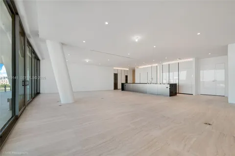 a view of walk in closet with clothes