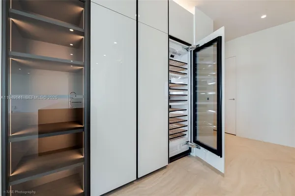a bathroom with a shower and a sink