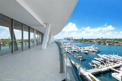 a terrace with water view and city view