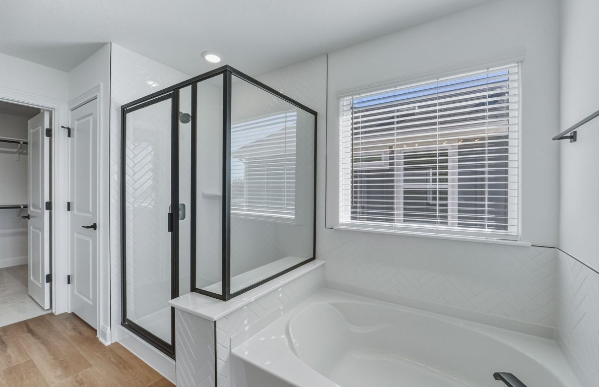 213 Regatta Trail Leander, TX 78641 - Photo 11 of 26 a bathroom with a bathtub and a shower