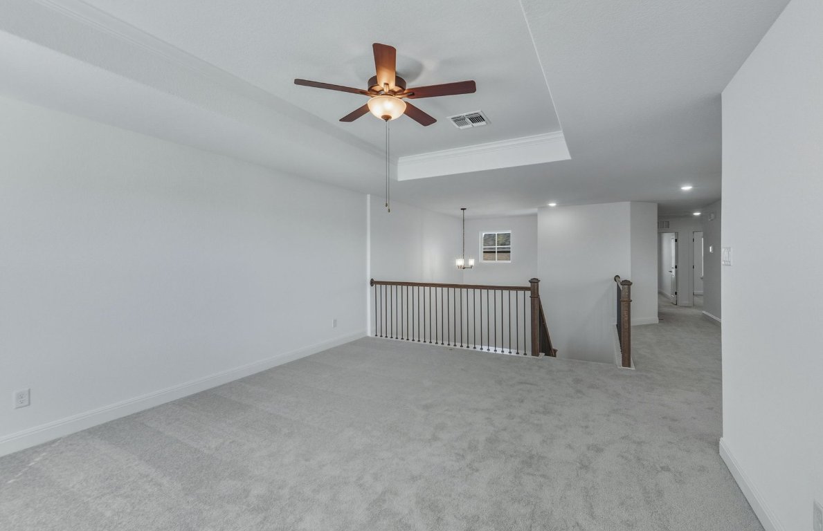 213 Regatta Trail Leander, TX 78641 - Photo 15 of 26 an empty room with fan and windows