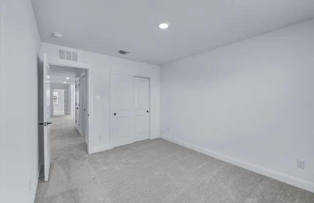 a view of a livingroom with a ceiling fan and window