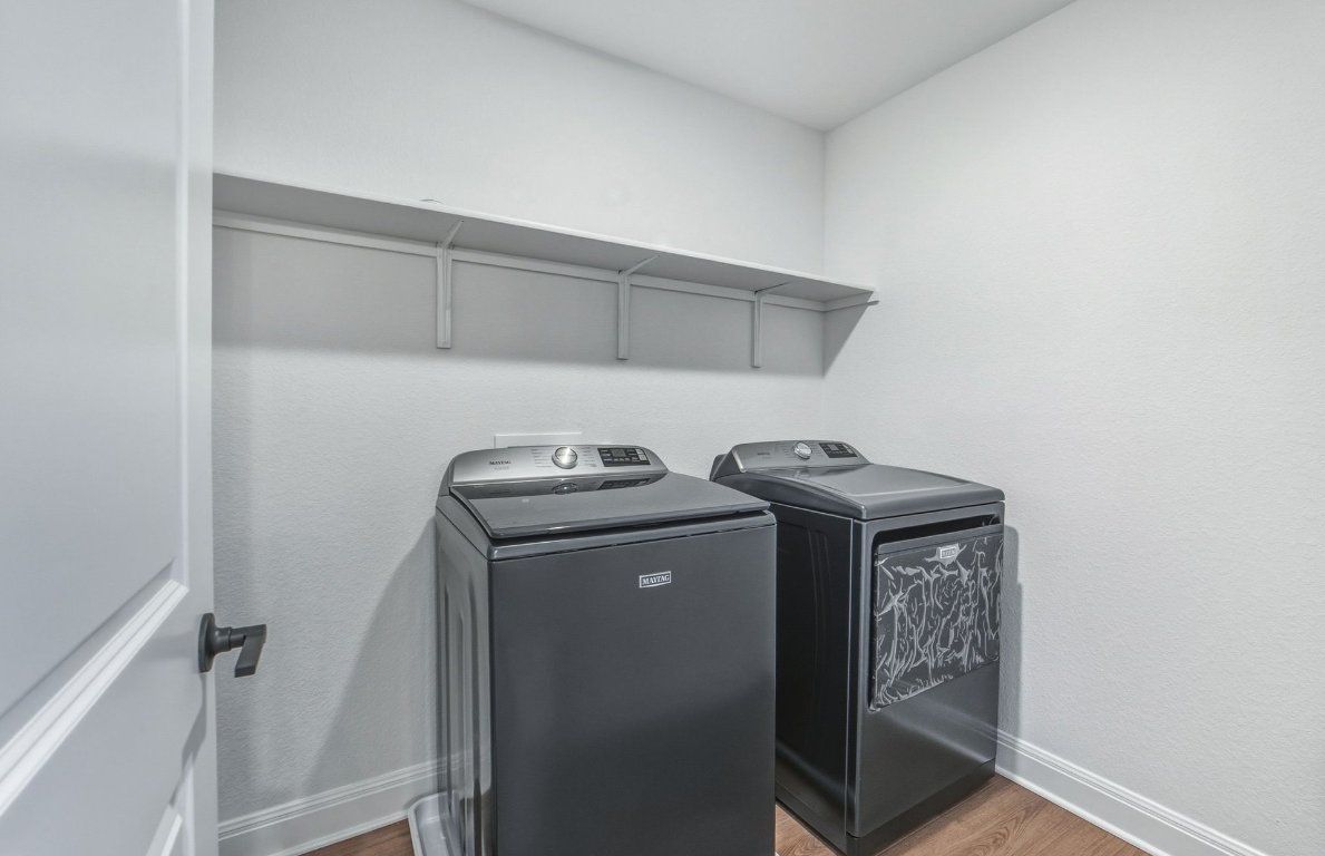 213 Regatta Trail Leander, TX 78641 - Photo 20 of 26 a utility room with dryer and washer