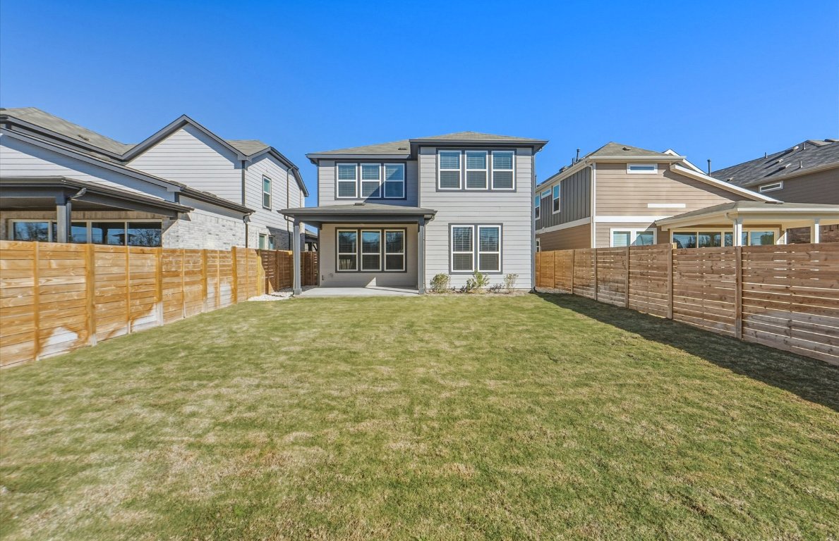 213 Regatta Trail Leander, TX 78641 - Photo 21 of 26 a front view of a house with a yard