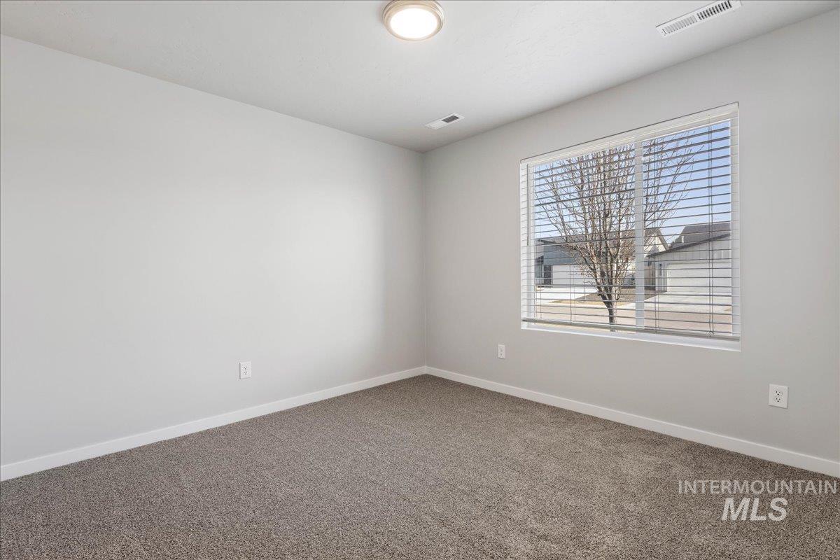 3085 S Green Boise, ID 83709 - Photo 18 of 32 Carpeted spare room with baseboards