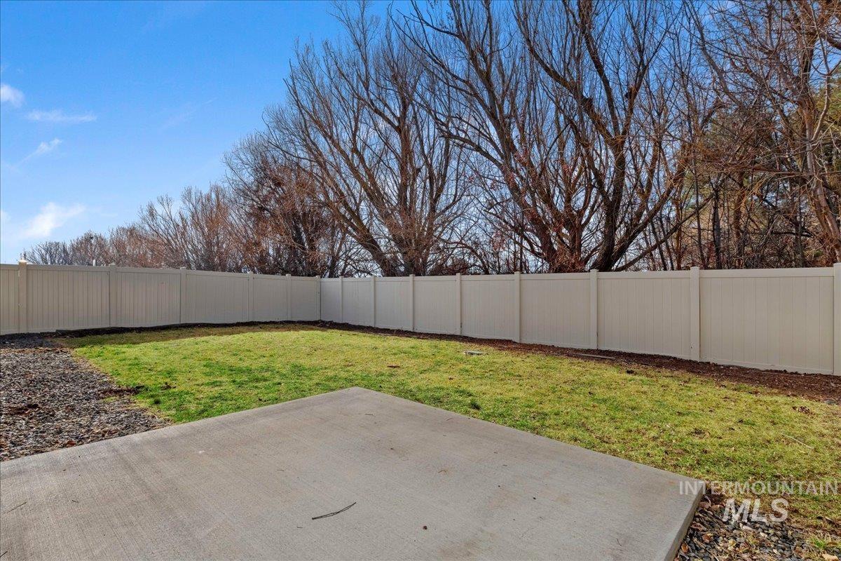 3085 S Green Boise, ID 83709 - Photo 31 of 32 Fenced backyard with a patio area