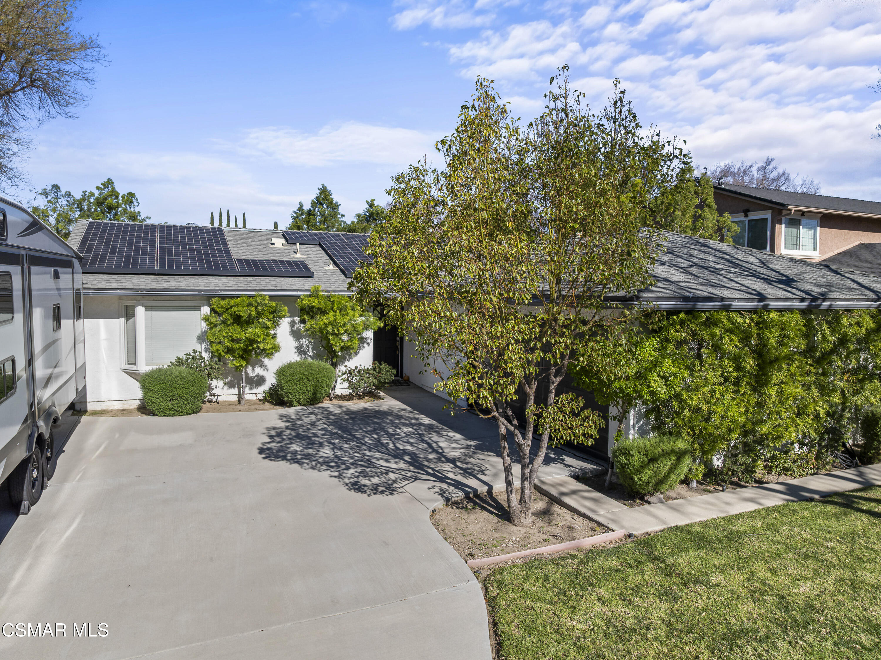 a view of a garden with a house