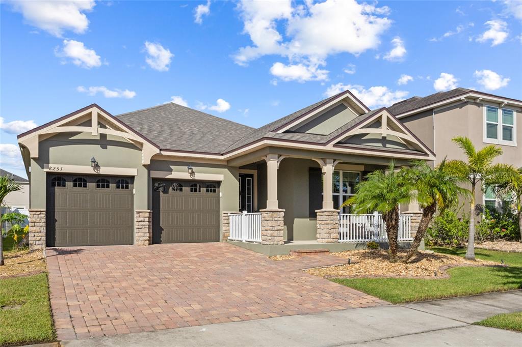 8251 Randal Park Boulevard Orlando, FL 32832 - Photo 1 of 1 a front view of a house with garden