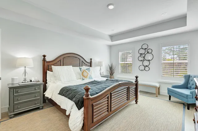 a bedroom with a bed and a couch