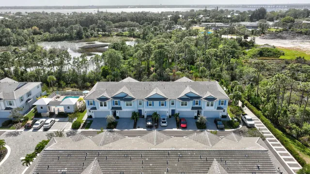 an aerial view of houses with yard