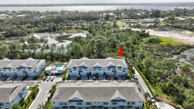 an aerial view of residential houses with outdoor space
