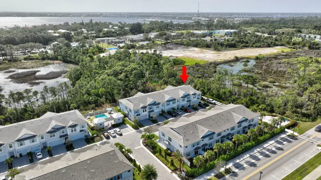 an aerial view of a house with a lake view