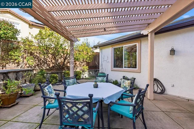a outdoor dining space with furniture and outdoor view