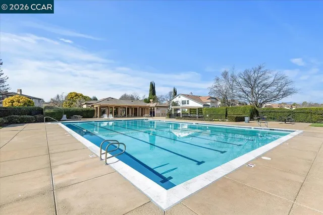 a view of swimming pool with a yard