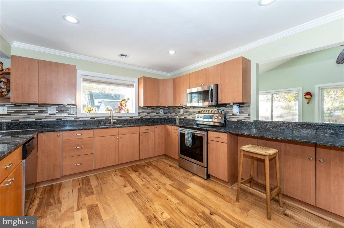 1306 3rd Road Middle River, MD 21220 - Photo 12 of 60 Modern kitchen with sleek finishes.