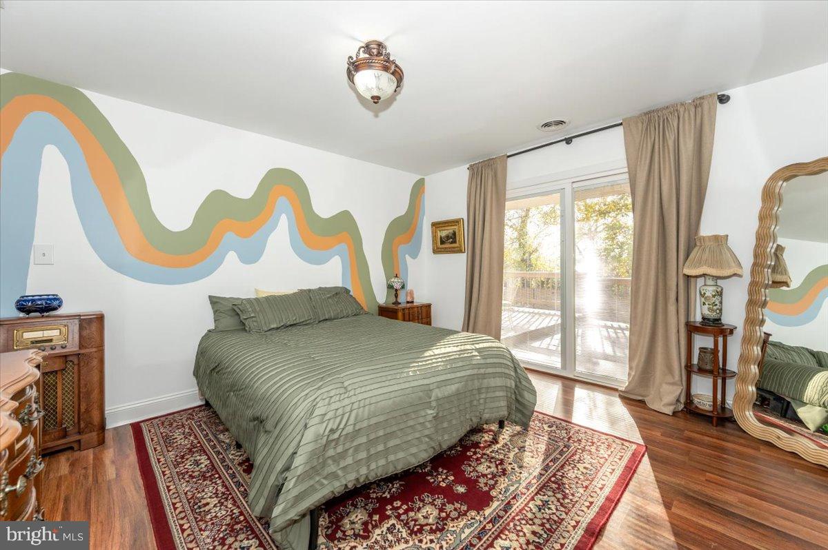 1306 3rd Road Middle River, MD 21220 - Photo 27 of 60 Vibrant bedroom with artistic wall design.