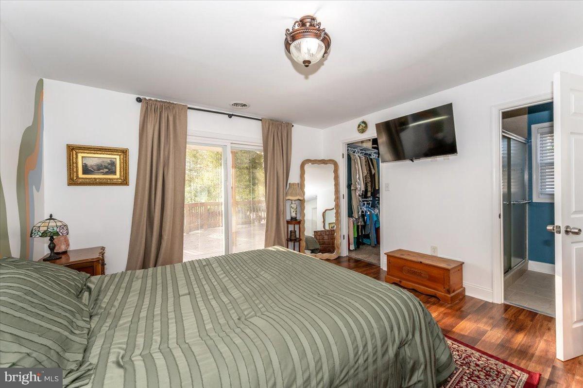 1306 3rd Road Middle River, MD 21220 - Photo 28 of 60 Serene bedroom with natural light and charm.