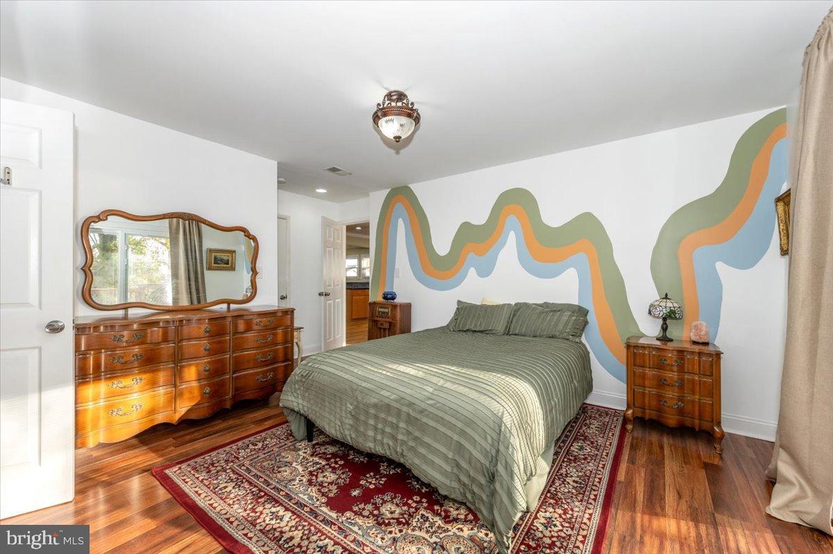 1306 3rd Road Middle River, MD 21220 - Photo 29 of 60 Vibrant bedroom with artistic wall design.